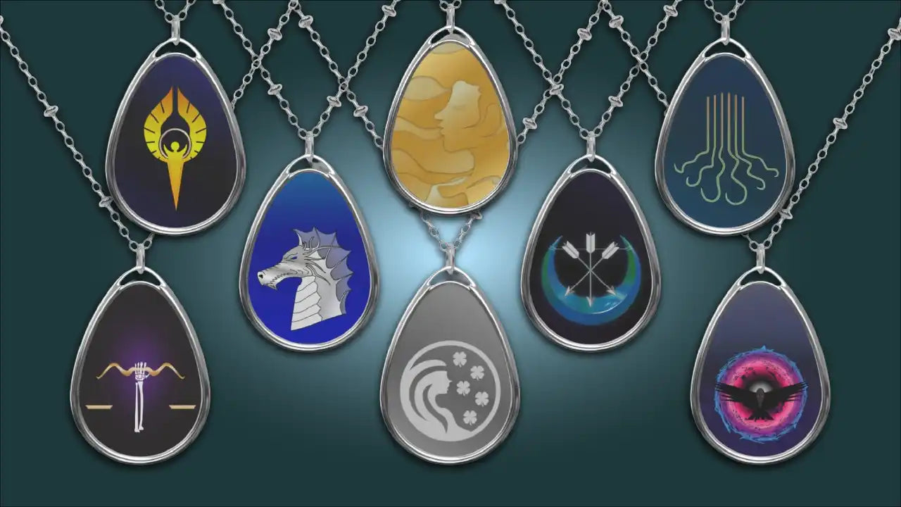 Silver teardrop-shaped pendant necklace with colorful gemstone inlays and intricate designs.